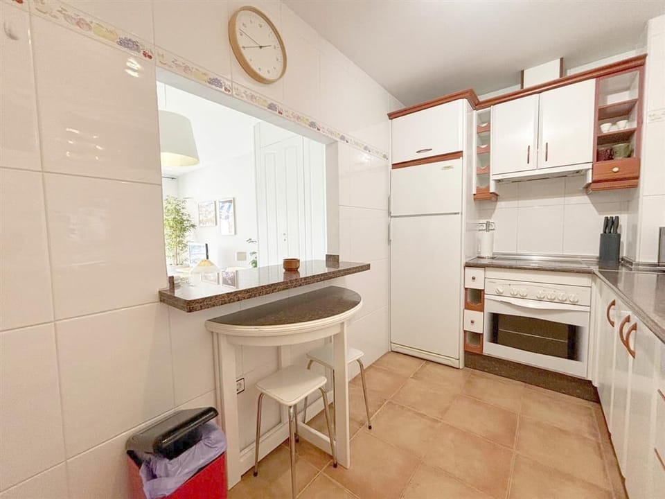 More pictures of the kitchen with dining area for two and serving bar