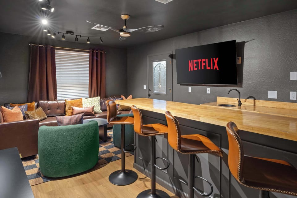 Our hidden speakeasy boasts a custom bar for all your favorite drinks; reachable only via hidden bookshelf door!