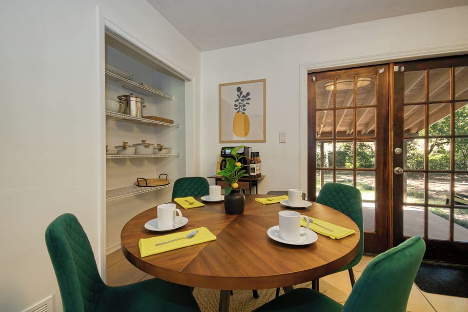 Dining table for 4 in the kitchen; has direct outdoor access