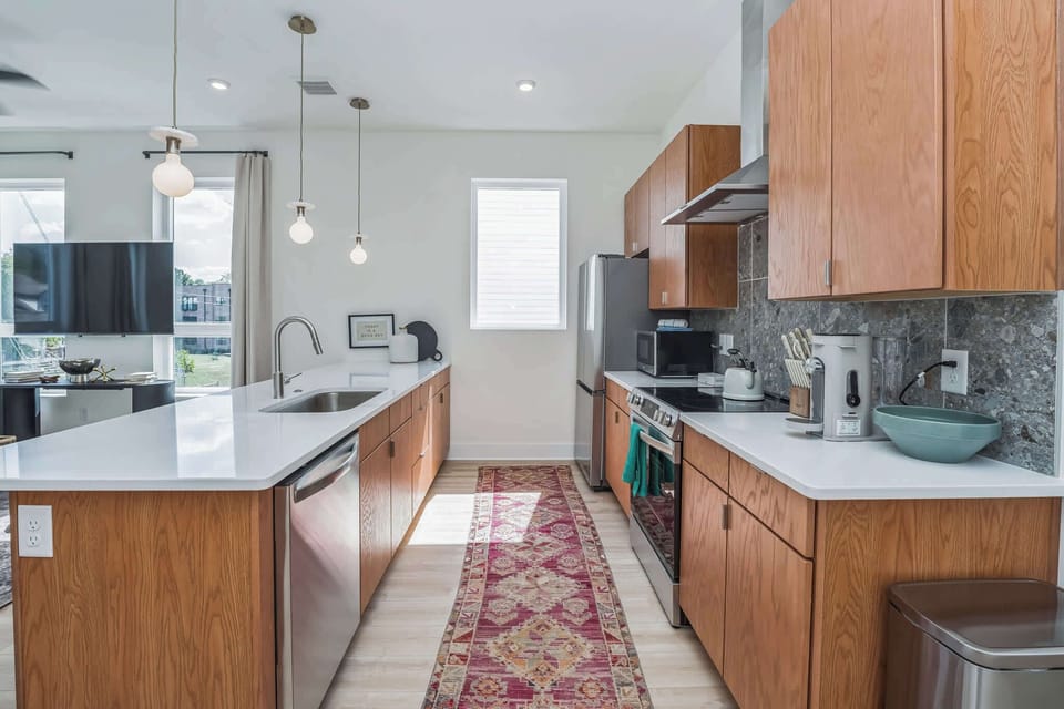 The chic, updated kitchen offers ample space & every home comfort