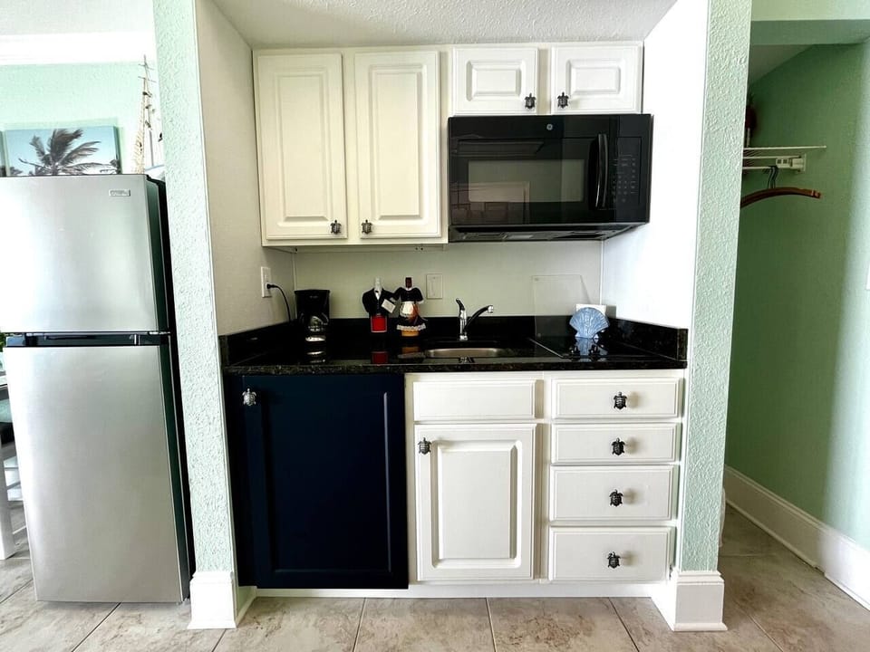 Fully equipped mini-kitchen and full=sized refrigerator.