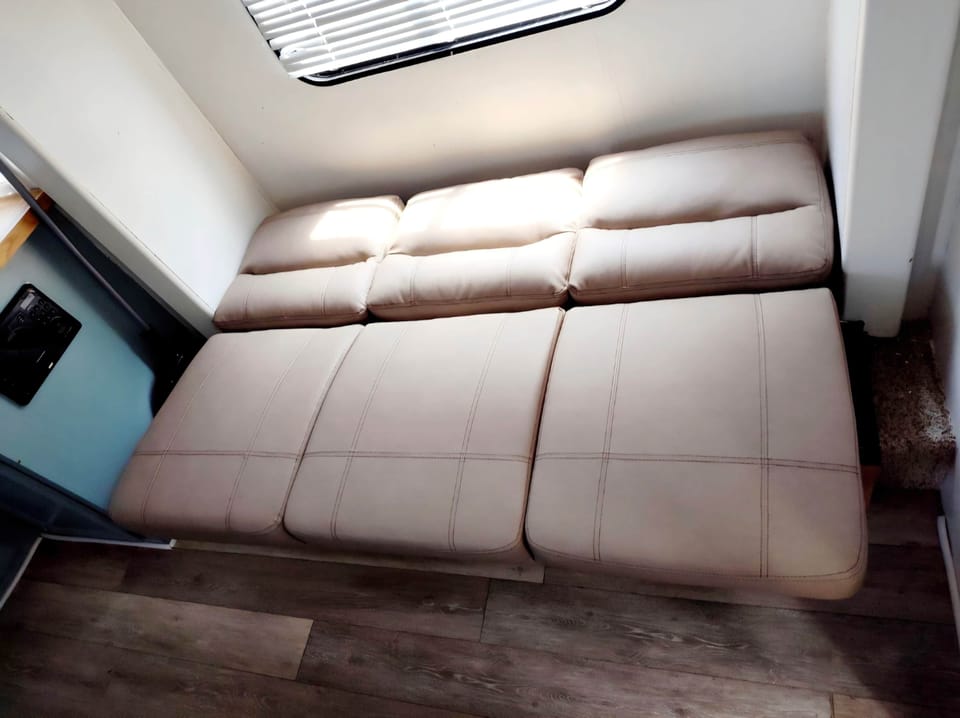 The jack-knife sofa lays down into a single sleeper.