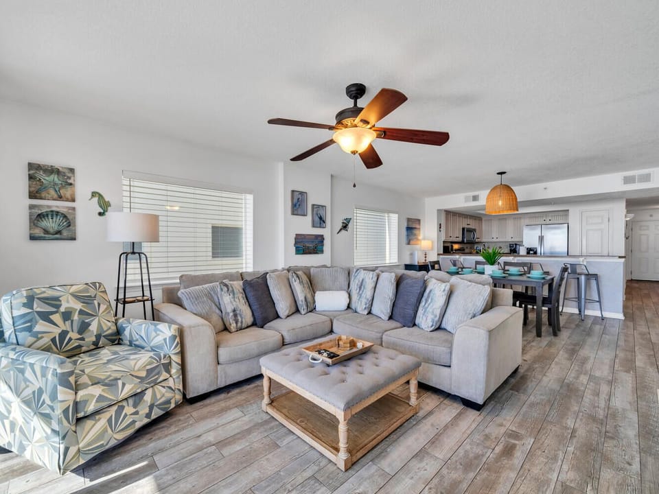 Sink into this spacious sectional sofa where coastal comfort meets modern style in your open-concept living space.
