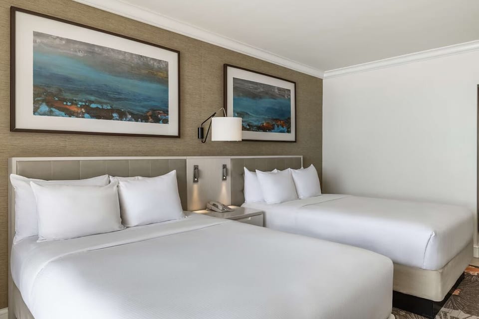 Unit with 2 Double beds. Exact unit will be assigned upon arrival. Views, colors, and decor may vary.
