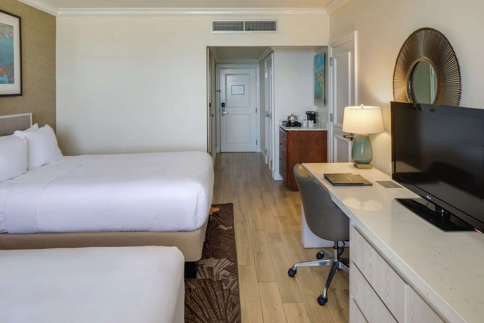 Unit with 2 Double beds. Exact unit will be assigned upon arrival. Views, colors, and decor may vary.