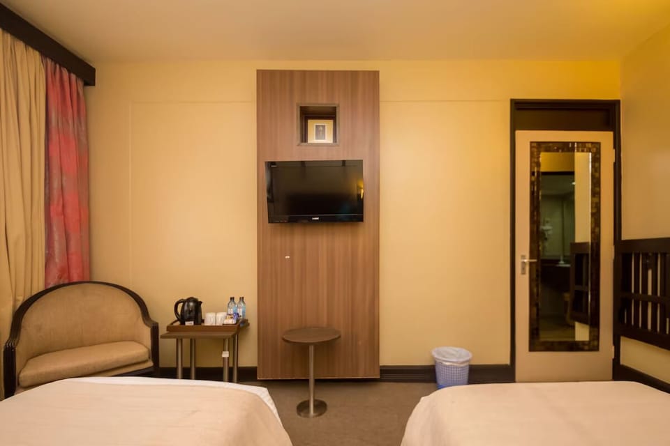 Unit with 2 Twin beds. Exact unit will be assigned upon arrival. Views, colors, and decor may vary.