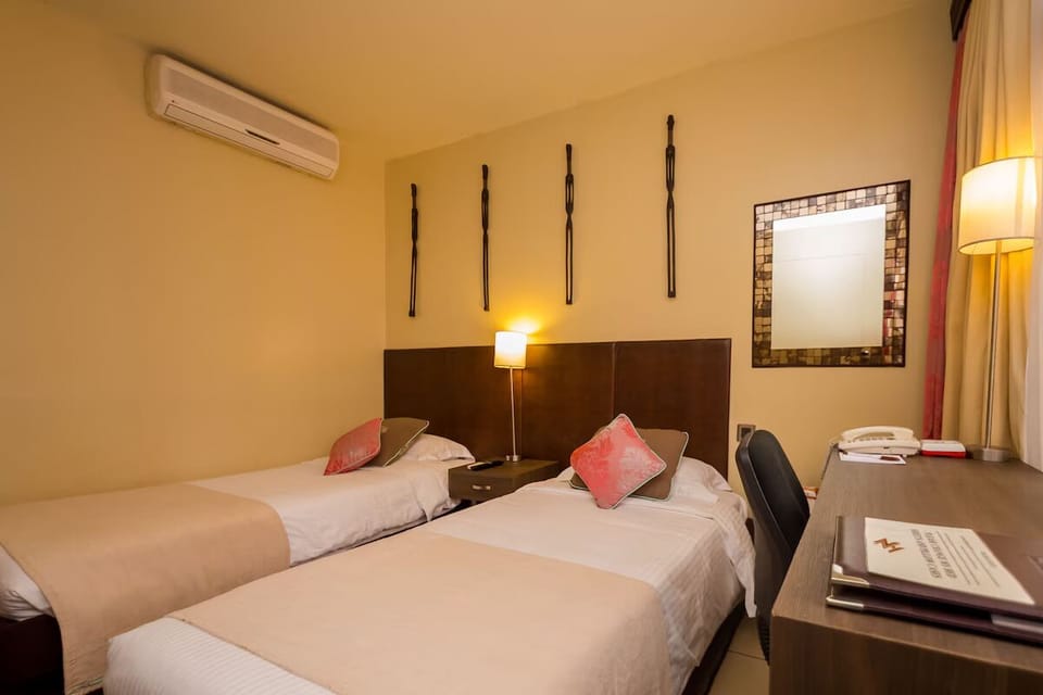 Unit with 2 Twin beds. Exact unit will be assigned upon arrival. Views, colors, and decor may vary.