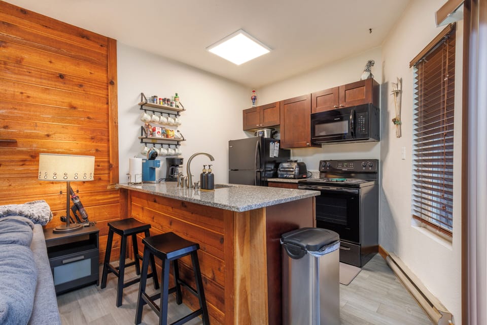 Full kitchen with dishwasher, stove and oven microwave and full size fridge. 