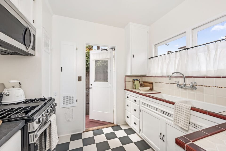 Your kitchen door leads to a private back patio to enjoy your morning coffee or let your dog out.