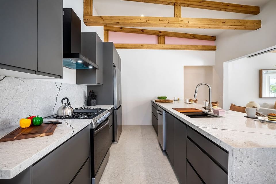 Love to cook on vacation? Our villa’s fully equipped kitchen has everything you need for your culinary creations. From modern appliances to ample counter space, this sleek, stylish kitchen is perfect for whipping up delicious meals.