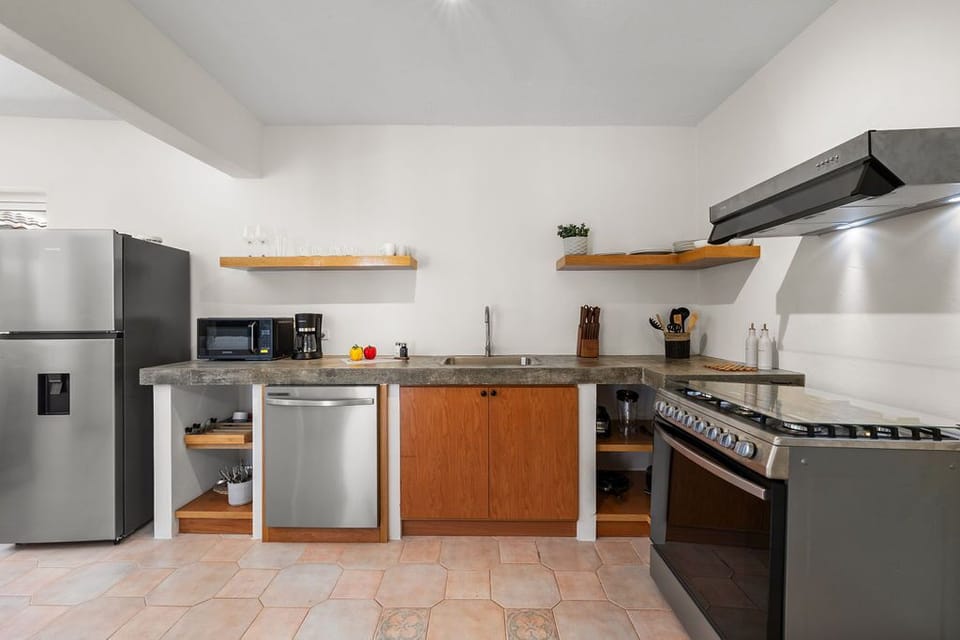 Step into the heart of the home with this fully functional kitchen, designed to meet all your culinary needs.