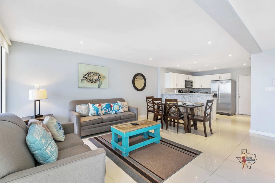 As you enter, you’ll be greeted by an inviting and luminous living space