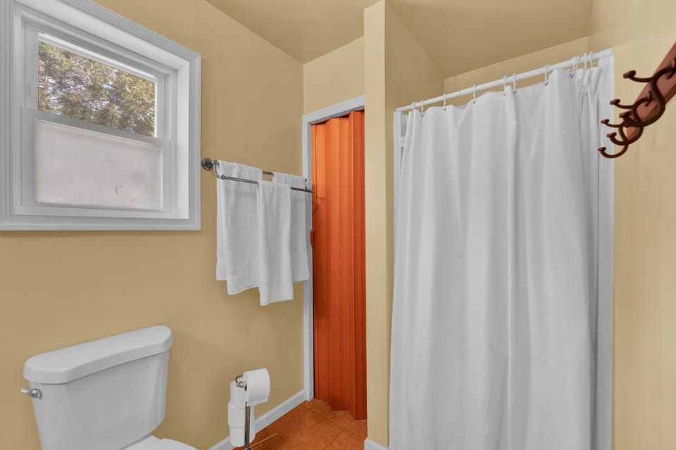 Step into the sleek bathroom featuring a walk-in shower.
