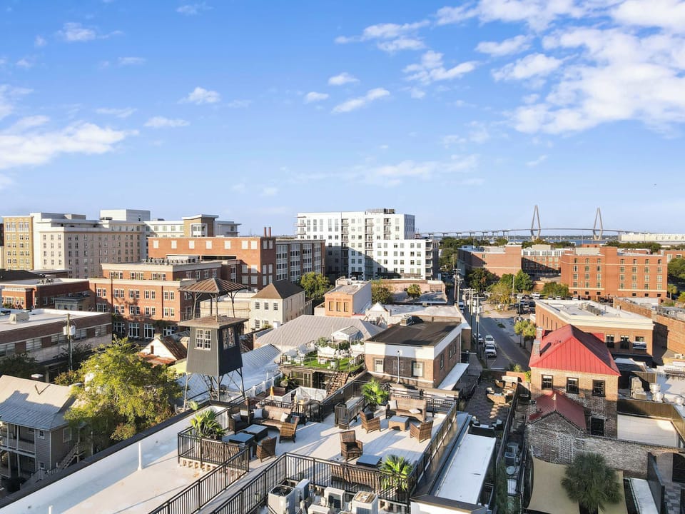 Birds eye view of FireTower rooftop with expansive views of Charleston and the Ravenel Bridge