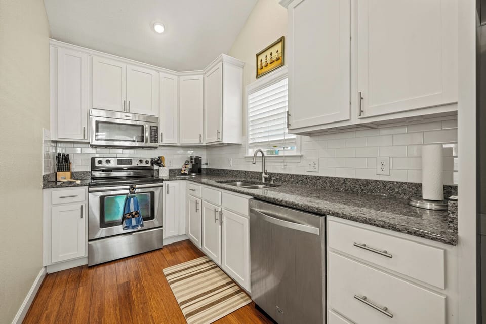 Kitchen with Bar Stool Seating on Third Level