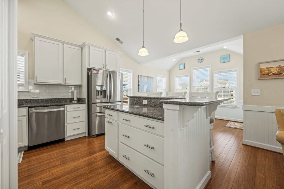 Kitchen with Bar Stool Seating on Third Level