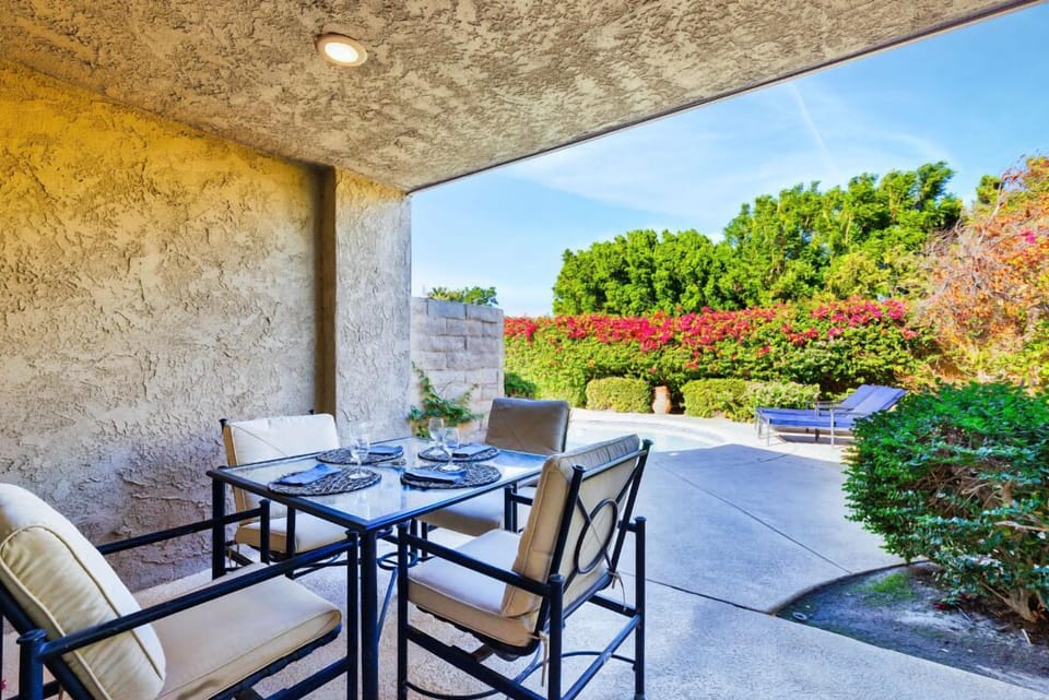 Covered outdoor patio - perfect space for dining or relaxation.