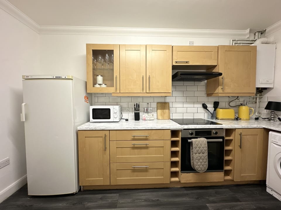 Kitchen with fridge only. Cooking facility available please view facilities.
