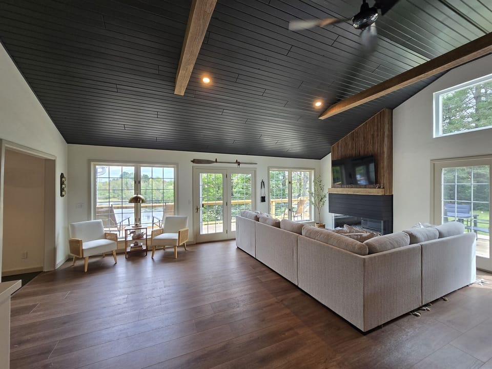 Large living room with vaulted ceilings and lots of natural light.