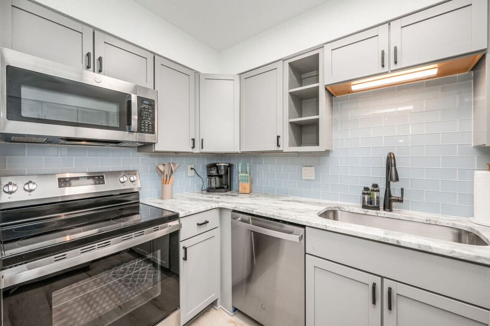 Cook effortlessly with premium appliances and cohesive modern kitchen design.