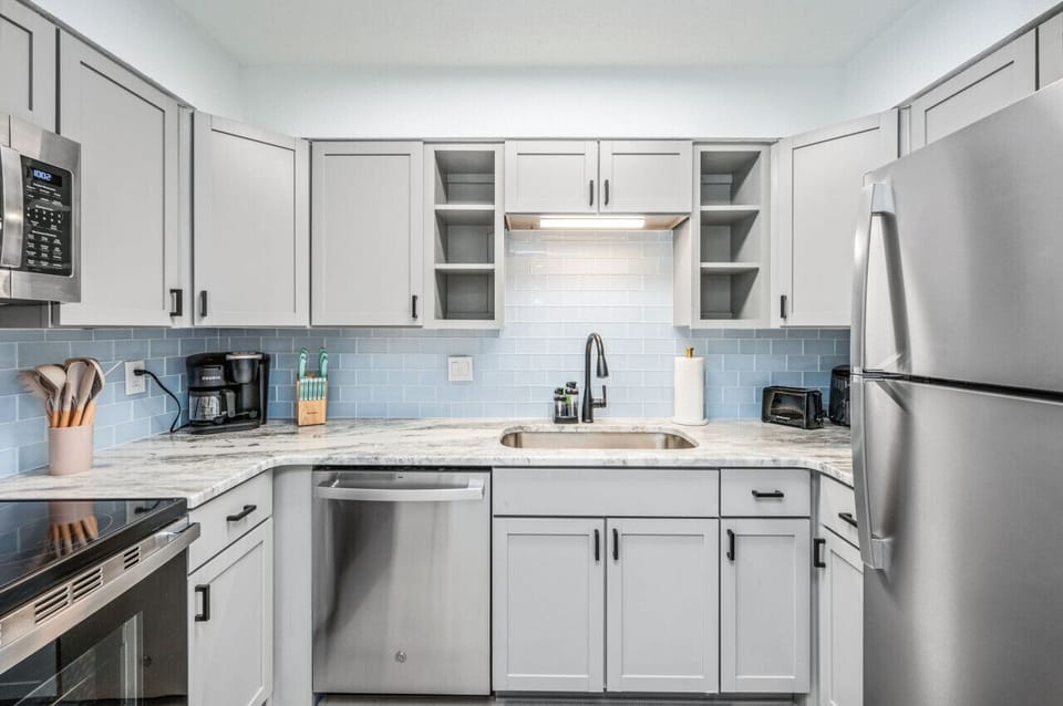 Bright kitchen space with marble counters and seamless daily function.