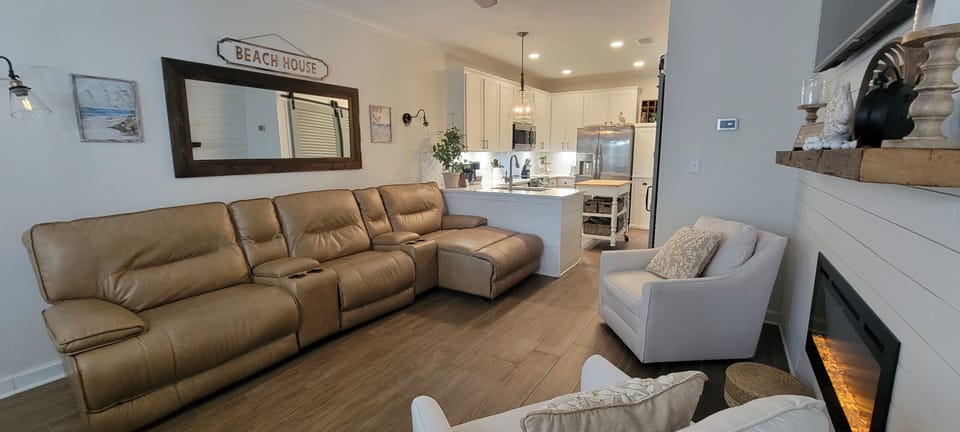 Newly remodeled living room with swivel chairs & reclining sofa