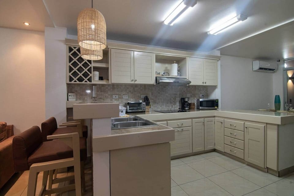 "Experience Costa Rican cuisine from the comfort of your own kitchen at Amara House Arenal. Our fully equipped kitchen includes modern appliances and a full range of cookware, utensils, and dishes to prepare delicious meals during your stay."