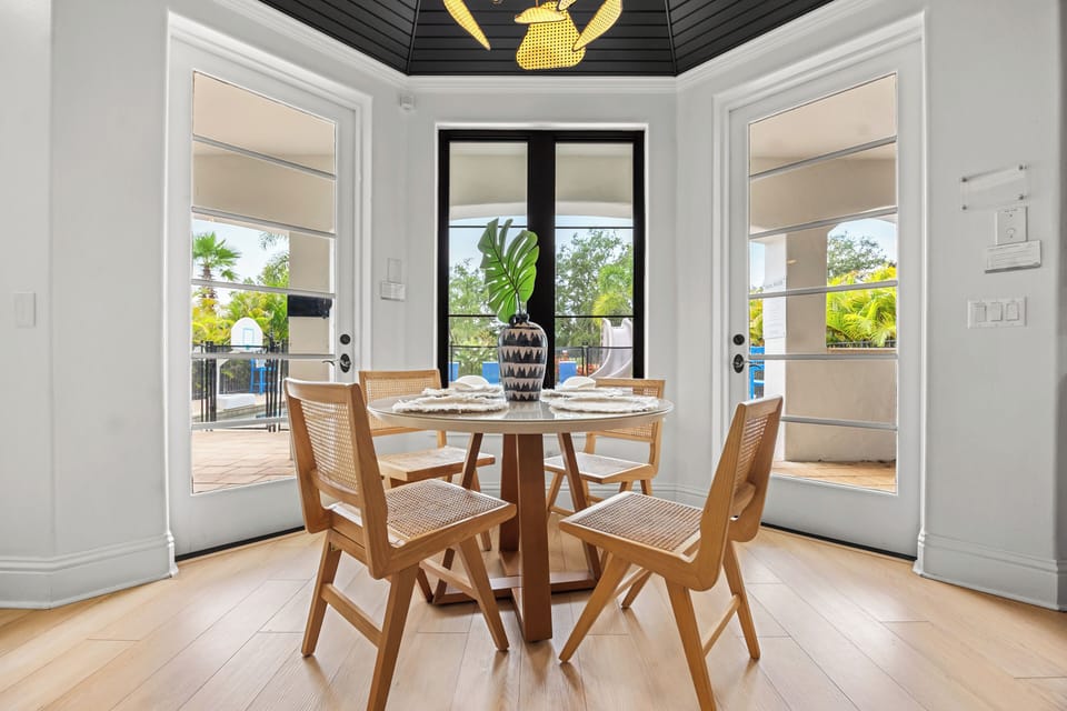 A cozy breakfast nook with seating for four offers a perfect spot for a casual morning coffee or late-night snacks.