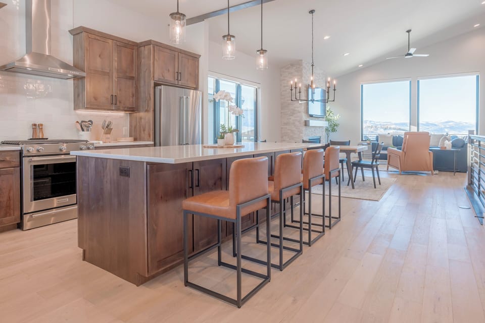 Main-level open concept living area with stunning mountain views upon entry.