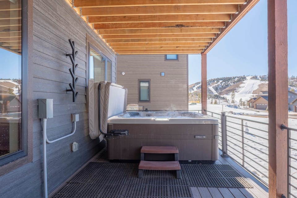Relax in the lower level hot tub while enjoying the beautiful views of Granby Ranch.