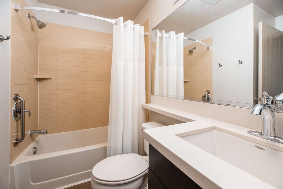 Refresh after a long day in a spotless, bright bath.