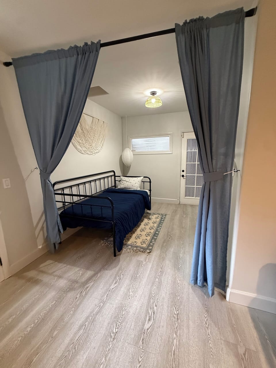 This bedroom is next to the living room. No stairs.