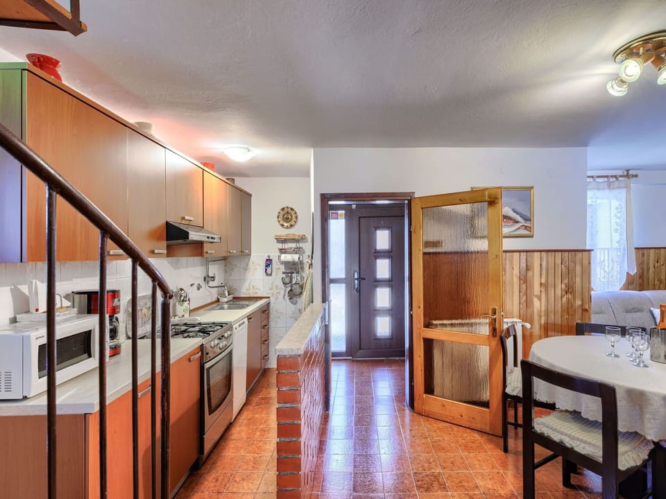 Furniture, Cabinetry, Countertop, Table, Kitchen, Wood, Interior Design, Lighting, Flooring, Floor
