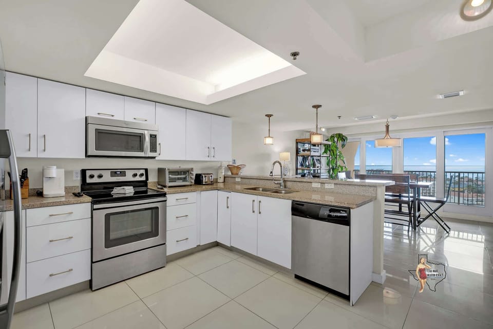 The sparkly kitchen has everything needed to prepare a meal at home.