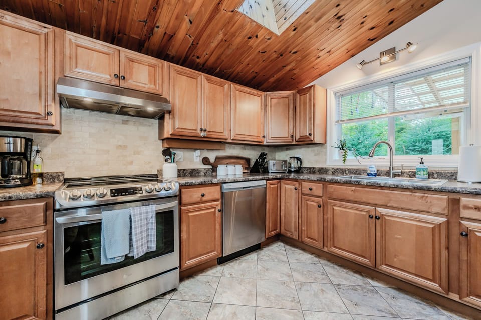 Gather around in the living room to watch a movie or enjoy some downtime in this inviting space with comfortable seating and beautiful wood accents.