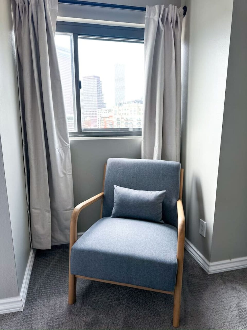 A comfy chair to relax in the bedroom.