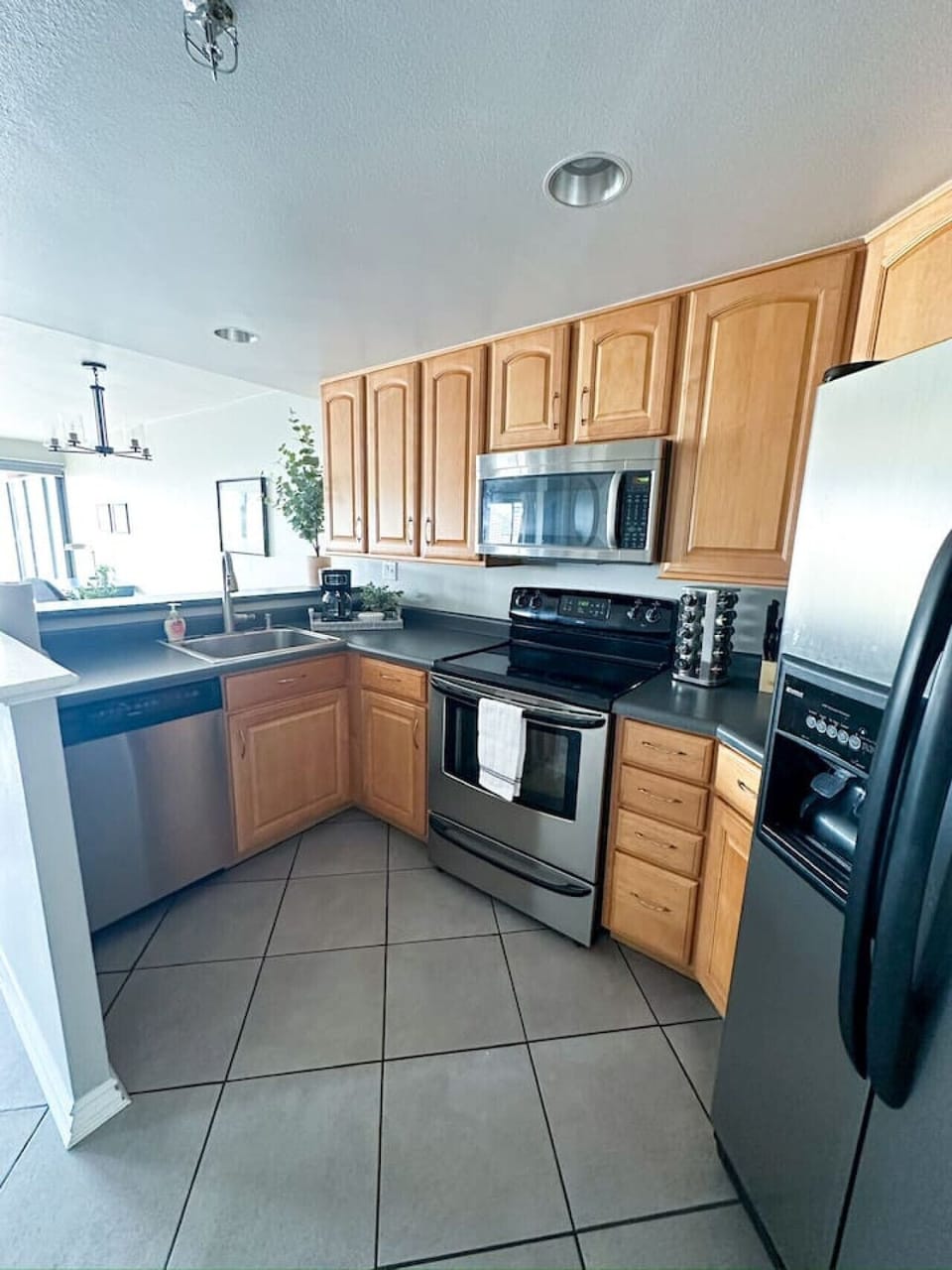From the sleek stainless steel appliances to the beautifully designed cabinetry, every detail invites you to picture yourself cooking up culinary masterpieces or enjoying a cozy family dinner.