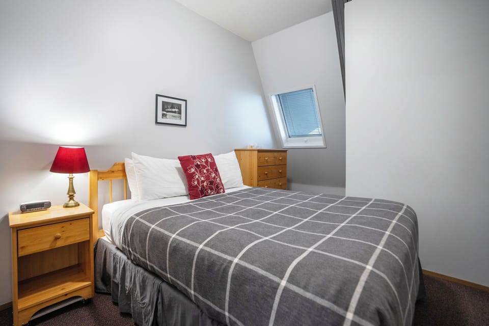 Queen sized bed. Closet is located to the left side of the bed.