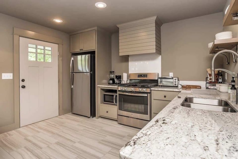 A stylish kitchen featuring modern appliances for cooking your favorite homemade dishes