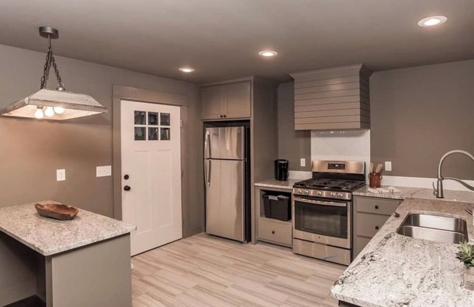 A stunning space with a spacious island for both preparation and gathering.