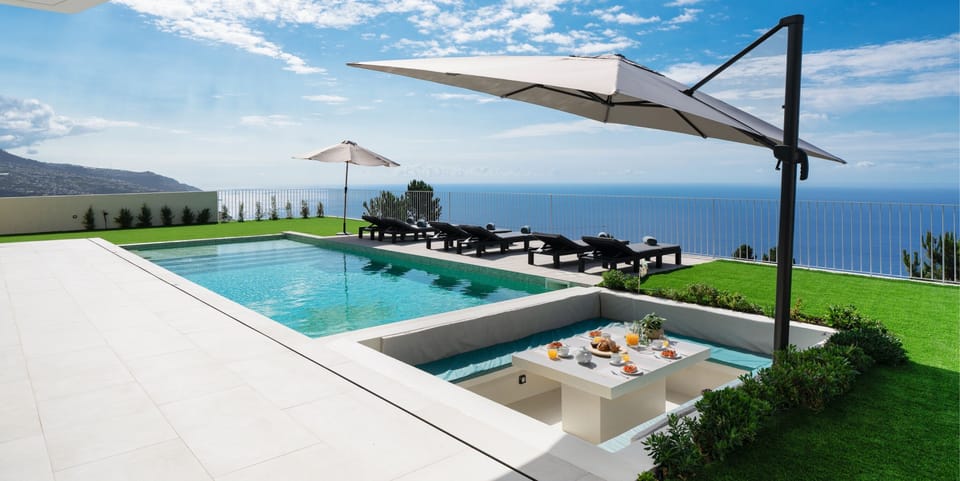 The Amazing View From The Seating Area Over The Private Swimming Pool And Sunjen Dining Table Of The Villa In Madeira Adagio By Ourmadeira