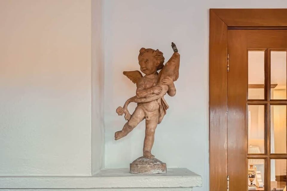 Statue of the Child with the Dolphin after Andrea del Verrocchio - Name giver Casa Delfino.