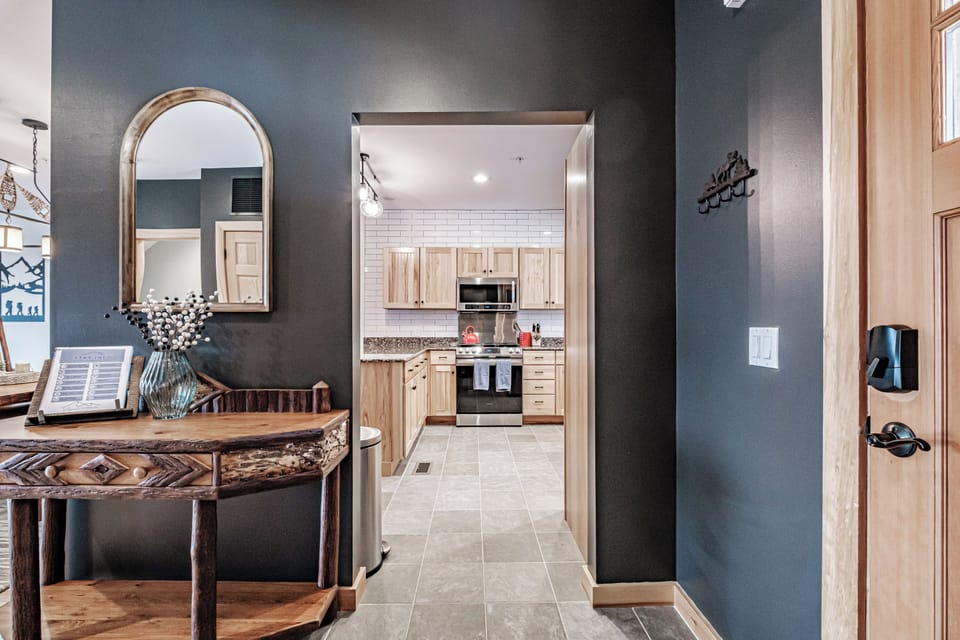 Step into a sleek, modern kitchen just off the entryway.