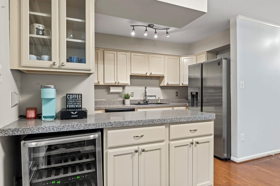 Wine cooler, coffee bar, granite countertops, stainless steel appliances