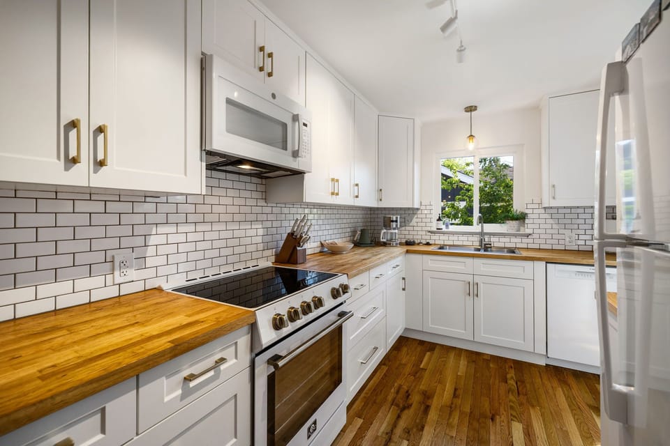 The kitchen is light and bright with a south facing window- a great spot for cooking and coffee. 