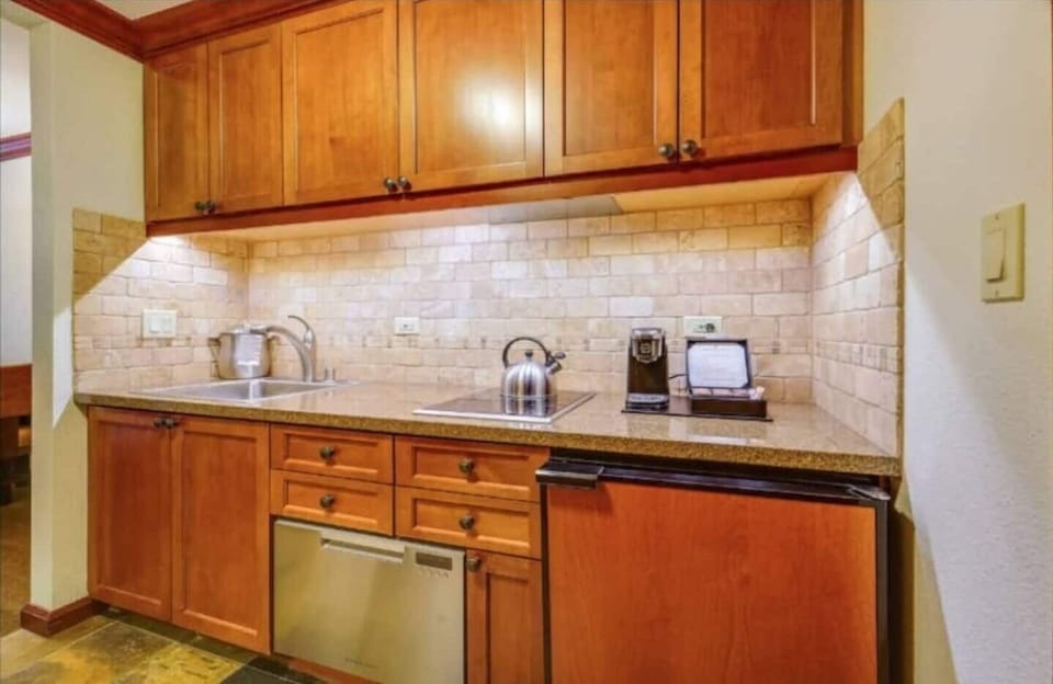 Kitchen with Dishwasher, Sink, Stove, Refrigerator, Coffee Maker, Toaster Oven