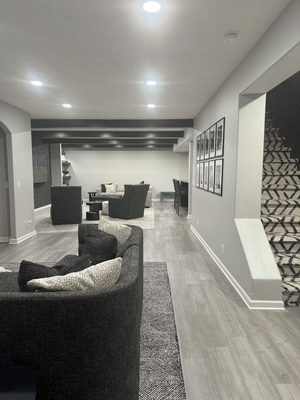 Additional seating area in basement area with tv