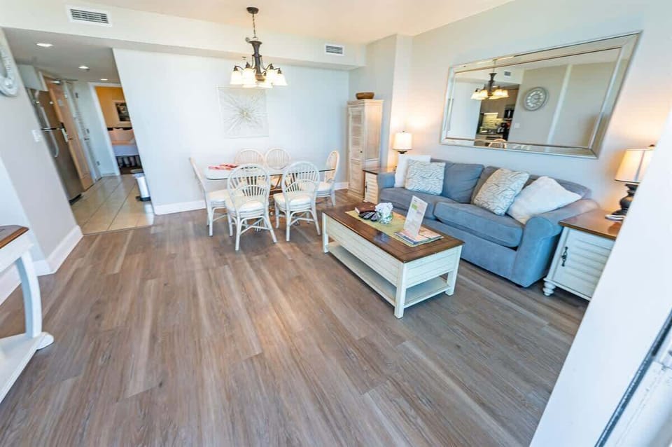 - Spacious and beautifully designed living area with an open concept layout - Comfortable seating, stylish decor, and a dining space perfect for gatherings - Bright and airy atmosphere, ideal for relaxation after a day at the beach 