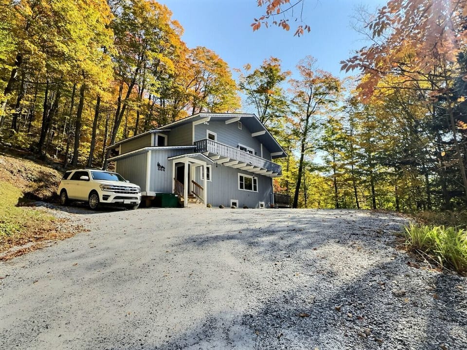 Spacious driveway and charming exterior.