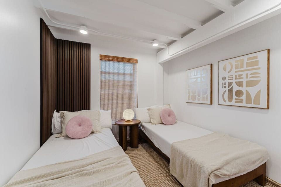 Perfect for friends or family, this shared room features two twin/full beds. While cozy and inviting, it fosters a cheerful atmosphere for a fun stay together.